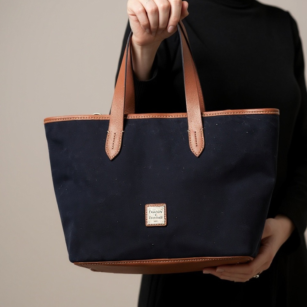 Navy Suade Dooney and Bourke satchel with brown leather trim
